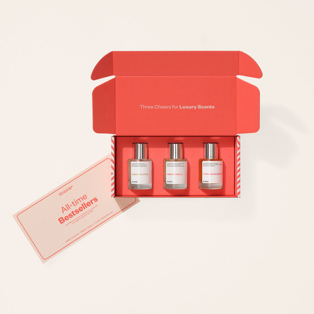 Open box containing three perfume bottles, displayed with an All-time Bestsellers card.